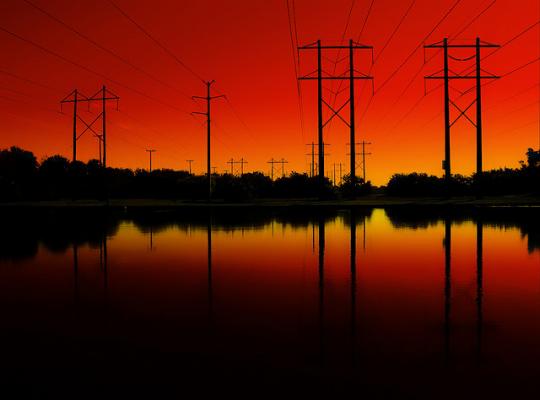 Power lines strecth over water. Source - DCCXLIX