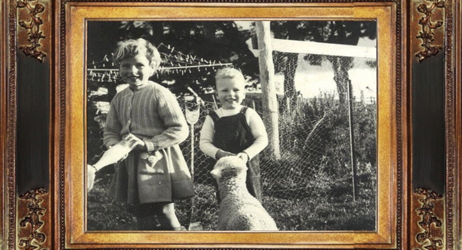 Growing up in New Zealand: Annette Dixon (left) with her brother Glenn, feeding household lambs while staying with relatives on a farm.