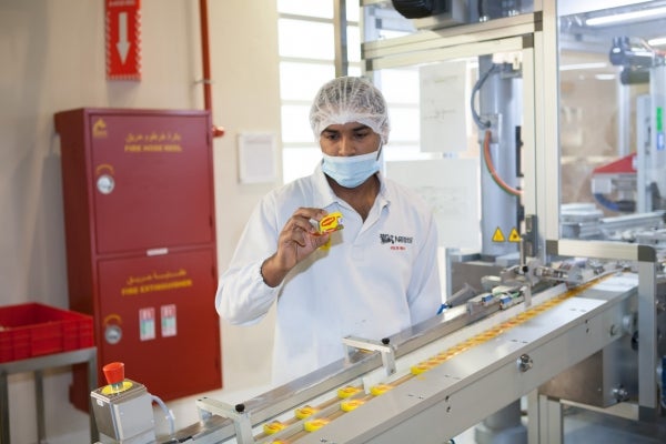 A Nestle worker checks food packaging for quality standards