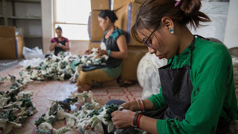 Women stitch handicrafts at Everest Fashion Fair Craft in Lalitpur, Nepal. © Peter Kapuscinski/World Bank