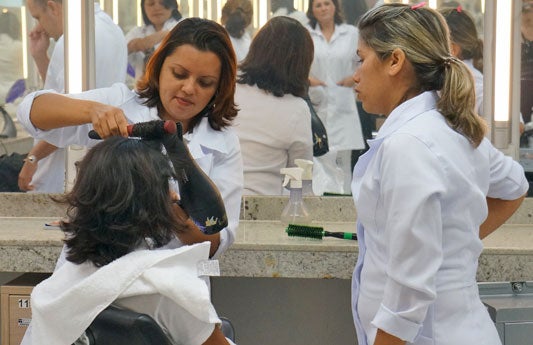 Young Brazilians learning hairdresser skills under a vocational program run by Sistema S Young Brazilians learning hairdresser skills under a vocational program run by Sistema S