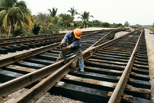 Man fixing railroad tracks, Mexico. Photo credit: Curt Carnemark / World Bank