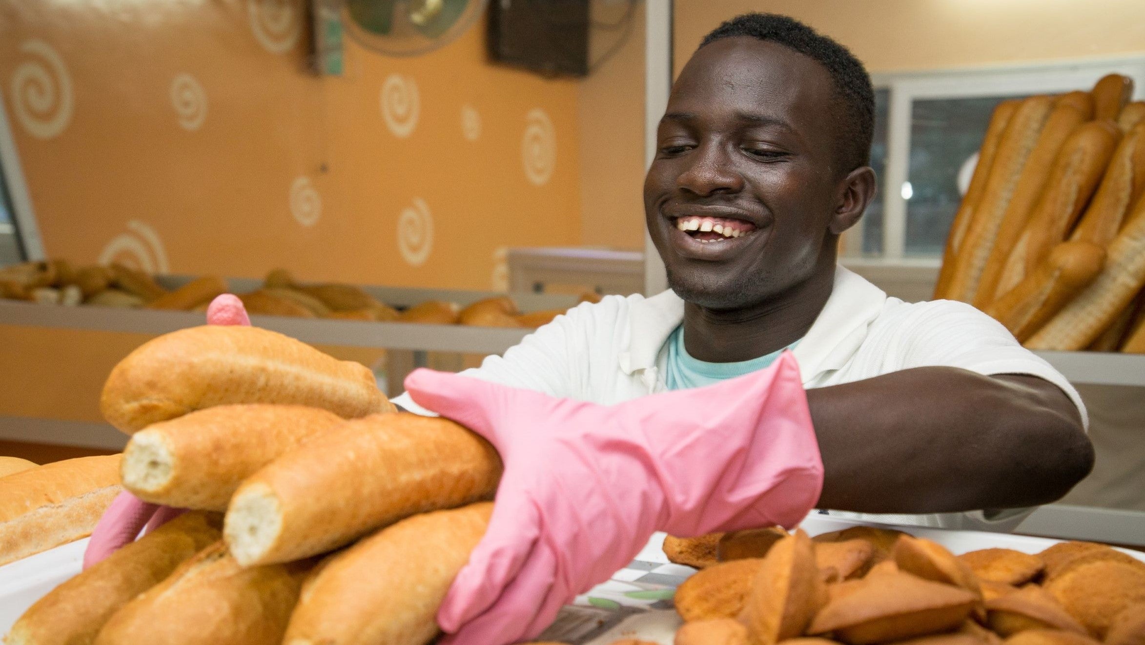 A young man working in the food industry in Senegal.