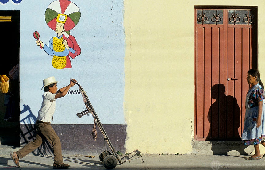 Man walking with dolly, Mexico.
