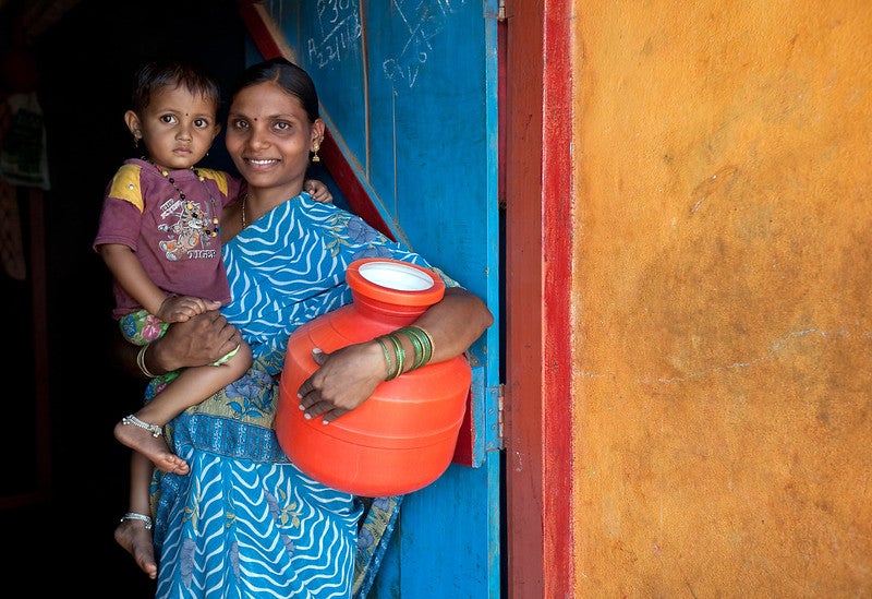 Geeta Bhogan (23) with her daughter Renuka at the family home in Bekkinakeri Village that she shares with family members and five cows. Geeta Bhogan (23) with her daughter Renuka at the family home in Bekkinakeri Village that she shares with family members and five cows.