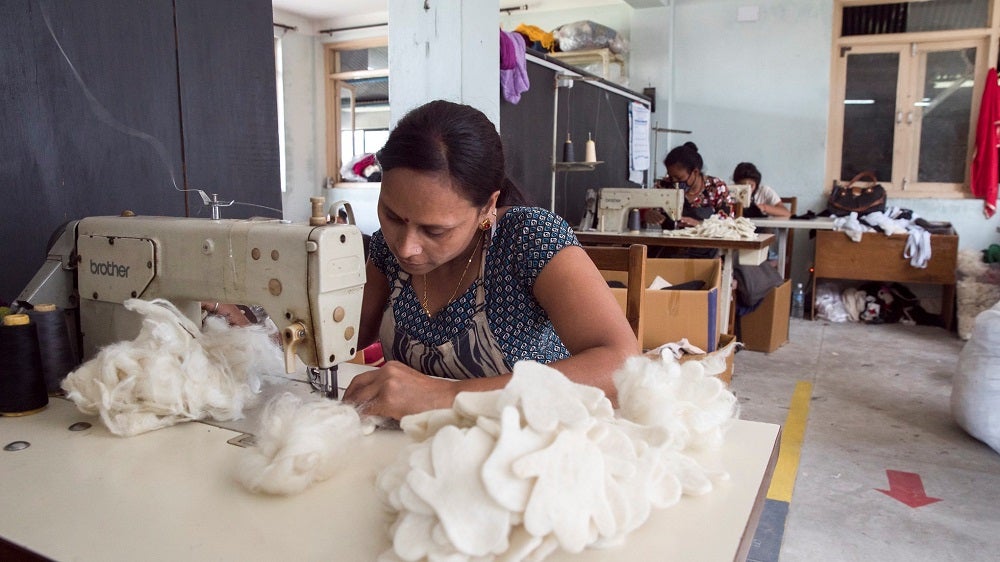 Workers at a clothing factory in Nepal. Workers at a clothing factory in Nepal.