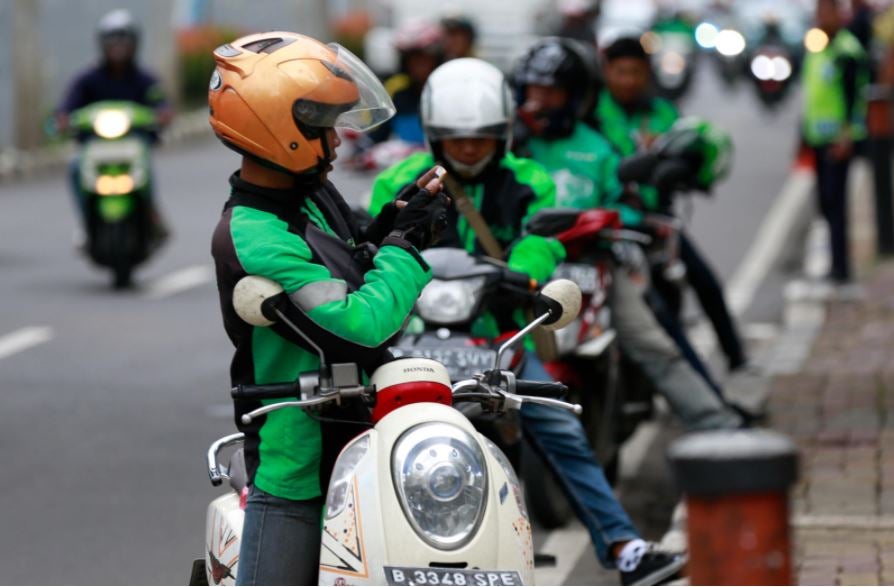 Man on motorbike. Jakarta, Indonesia