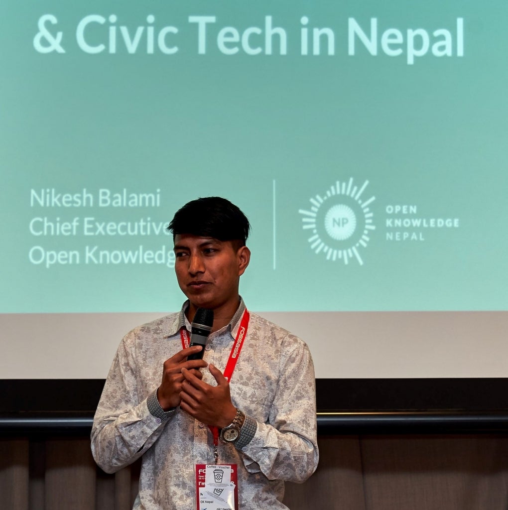 Nikesh Balami speaking at a program