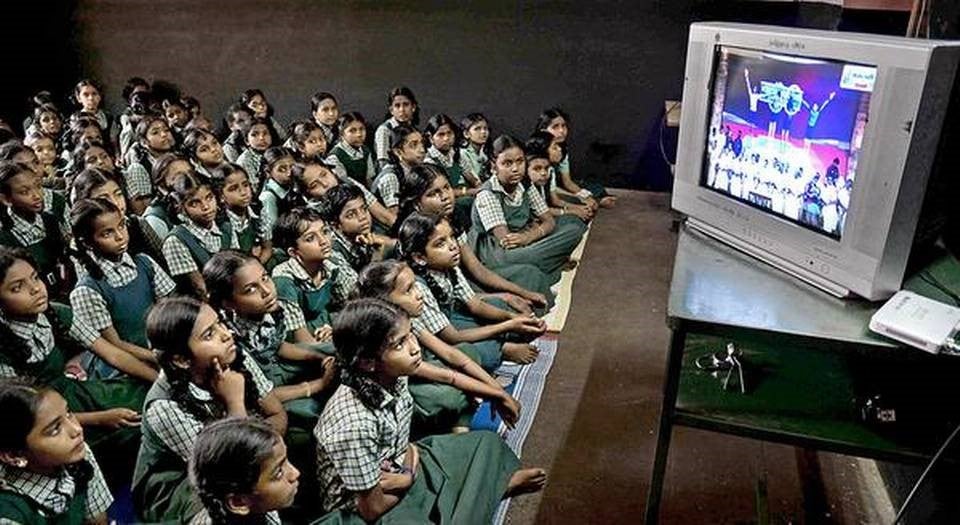 Students of Tamil Nadu (India) watching state-owned ?Kalvi Tholaikatchi? (educational television)