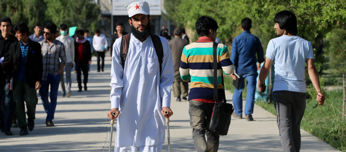 A student with disability at the National Institute of Management and Administration in Afghanistan A student with disability at the National Institute of Management and Administration in Afghanistan
