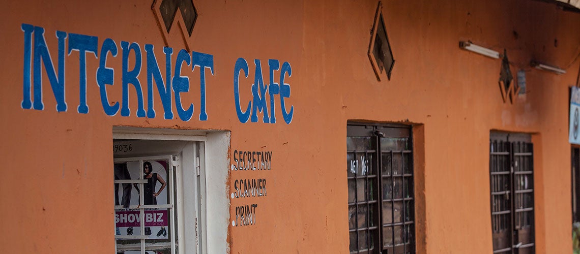 Internet cafe in the neighborhood of Nyamirambo in Kigali, Rwanda. Home to a mixed population, including much of the city?s working class and Muslim population, as well as bars, boutiques and hair salons, Nyamirambo is known to be one of the most vibrant neighborhoods of Kigali. Internet cafe in the neighborhood of Nyamirambo in Kigali, Rwanda. Home to a mixed population, including much of the city?s working class and Muslim population, as well as bars, boutiques and hair salons, Nyamirambo is known to be one of the most vibrant neighborhoods of Kigali.