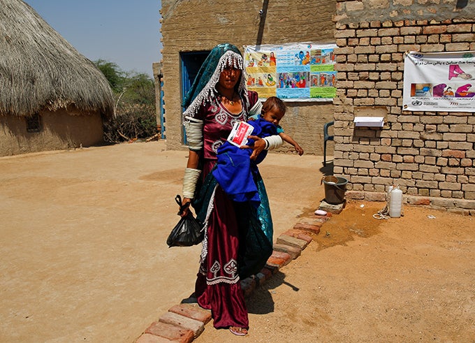 7 month old Lata with her mother leaves after check-up from UNICEF supported CMAM site in Village Meghwar Pro Chelhar, Tharparker District, Sindh Province, Pakistan. 7 month old Lata with her mother leaves after check-up from UNICEF supported CMAM site in Village Meghwar Pro Chelhar, Tharparker District, Sindh Province, Pakistan.
