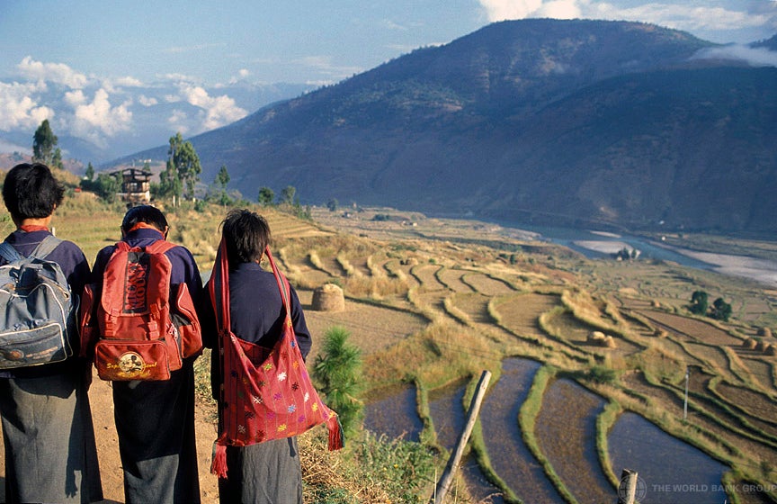Children in Bhutan look out on terraced fields. (Photo by Curt Carnemark / World Bank)