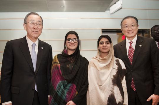 UN Secretary-General Ban Ki-moon, left, and World Bank Group President Jim Yong Kim, right, pose with education campaigners Shazia Ramzan and Kainat Riaz, who were caught up in the Pakistan gun attack on Malala Yousafzai and are in Washington to lobby for greater educational access. Photo: Roxana Bravo/World Bank