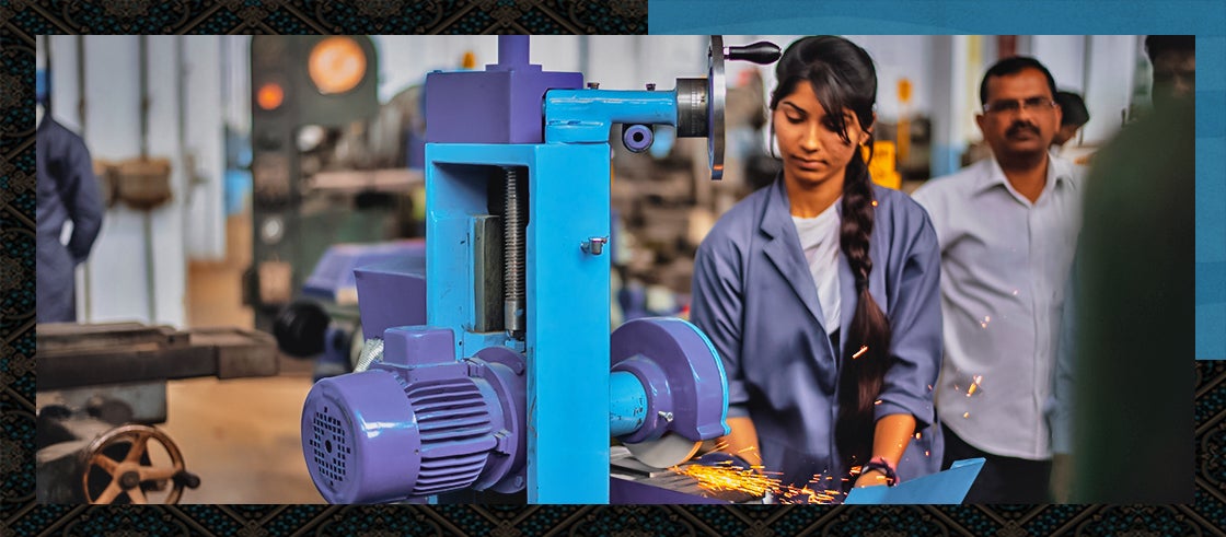 Woman technician operating grinding machine during industrial training class at a government industrial training institute in Meerut, Uttar Pradesh, India.