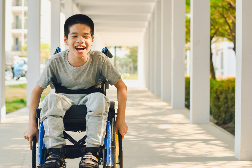 A young boy enjoying a wheelchair-accessible building