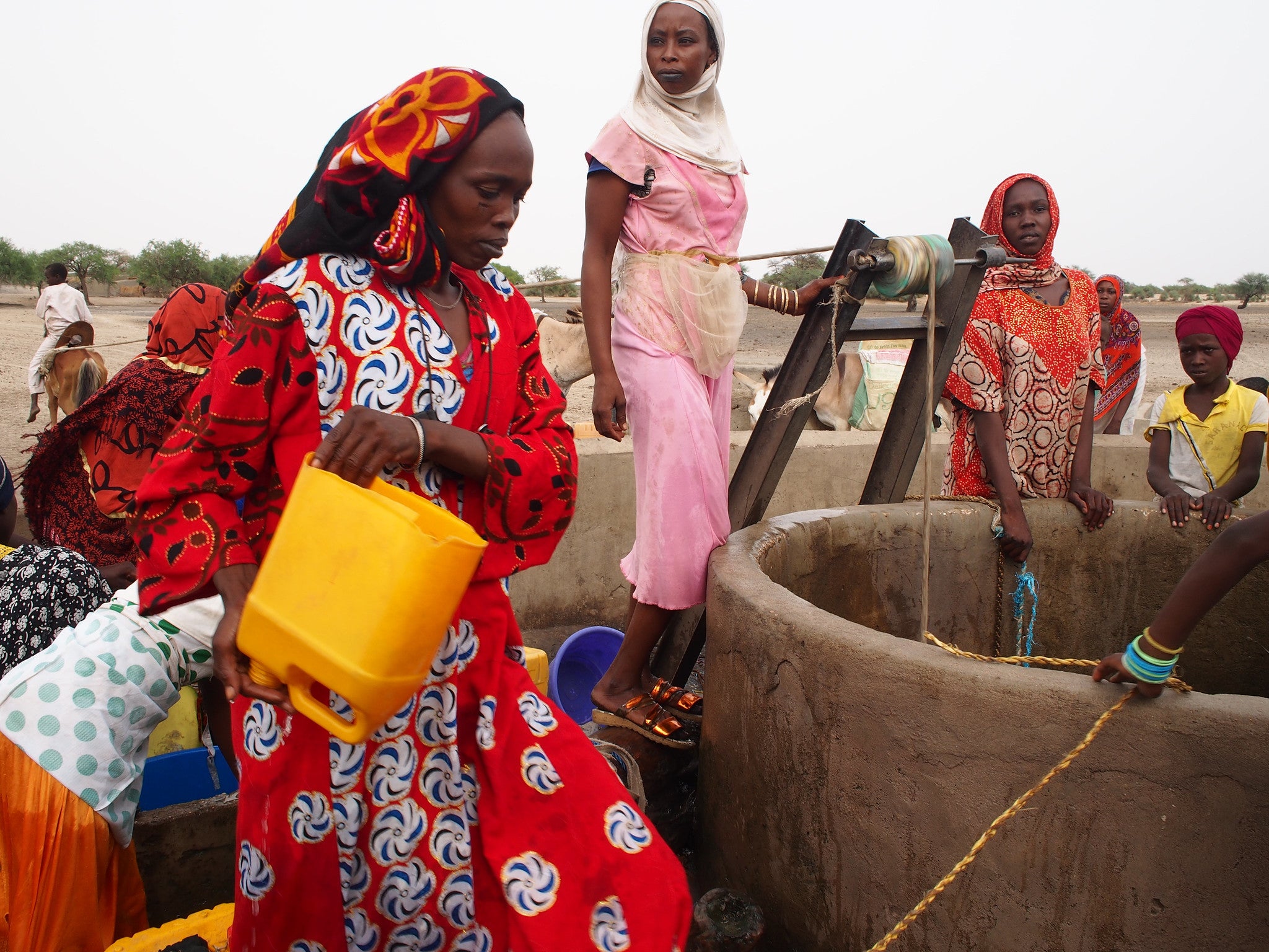 Women at a water well in Chad. Photo credit: Pierre Laborde/Shutterstock