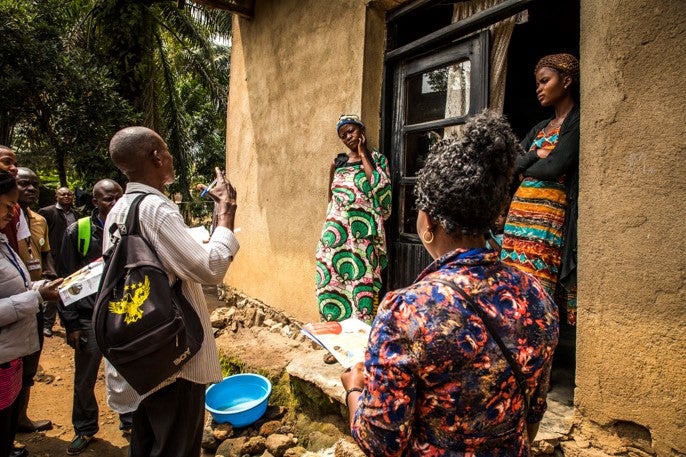 Community representatives come to visit a family in the outskirts of Beni Democratic Republic of Congo