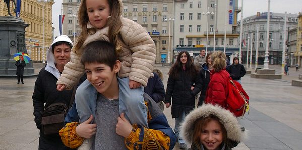 Children walk through Zagreb city square. Children walk through Zagreb city square.