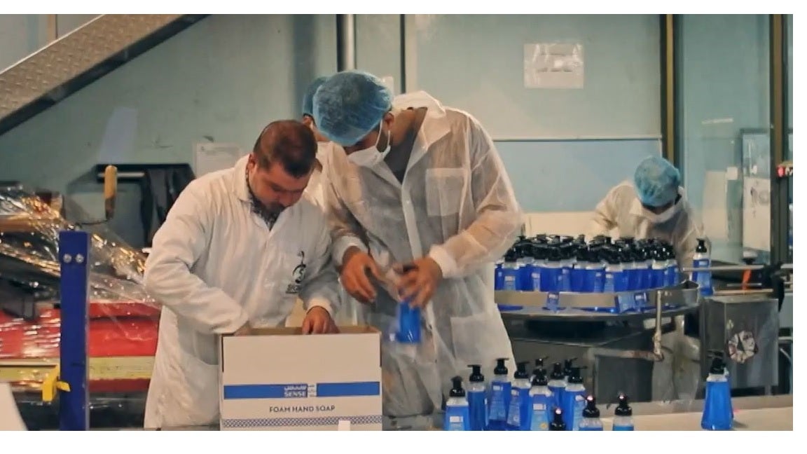 Two men at detergent factory