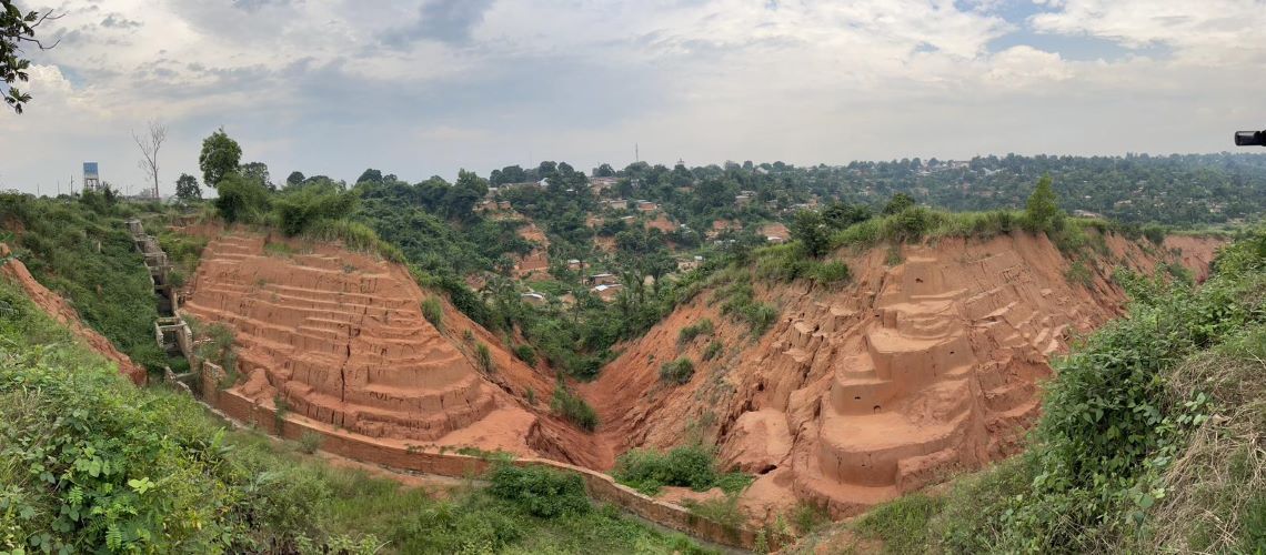 Wide gullies formed by soil erosion in Kananga, capital of the Kasai-Central province of the DRC. Wide gullies formed by soil erosion in Kananga, capital of the Kasai-Central province of the DRC.