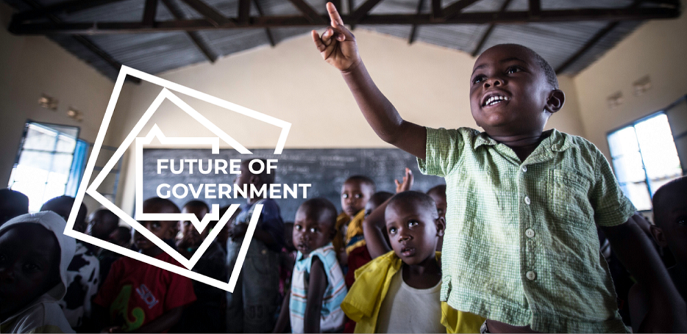The Future of Government postcard - boy reaching upward, smiling, in classroom The Future of Government postcard - boy reaching upward, smiling, in classroom