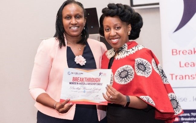 Training participant, Priscillah Oluoch (left) receiving her certificate from Patricia Murugami on graduation. Photo credit: Davasha Training participant, Priscillah Oluoch (left) receiving her certificate from Patricia Murugami on graduation. Photo credit: Davasha
