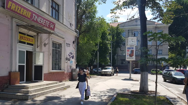 A lady walking in the street of Chisinau, Moldova