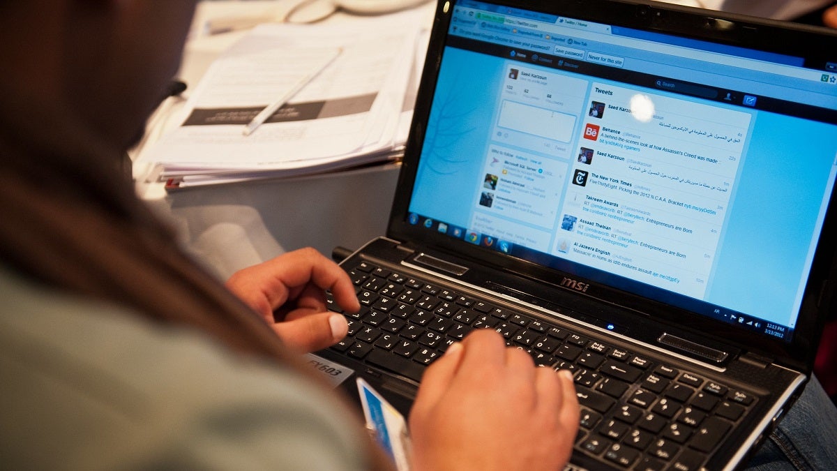 Woman typing on her laptop. Photo: Arne Hoel/World Bank