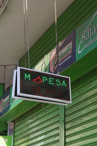 M-PESA signs are a common sight all over Kenya. (Credit: Global.finland.fi, Flickr Creative Commons)