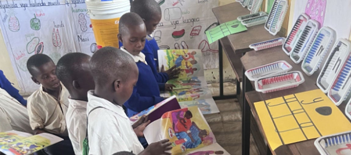 Preprimary students reading story books at Chemba district school. Photo: Magreth Mziray/World Bank