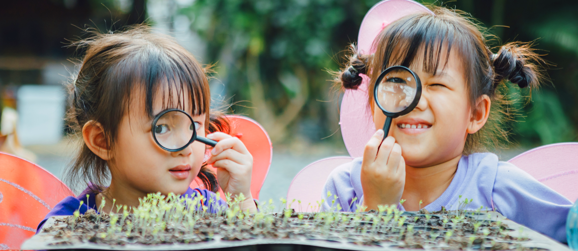 Little children play and explore in the garden Little children play and explore in the garden