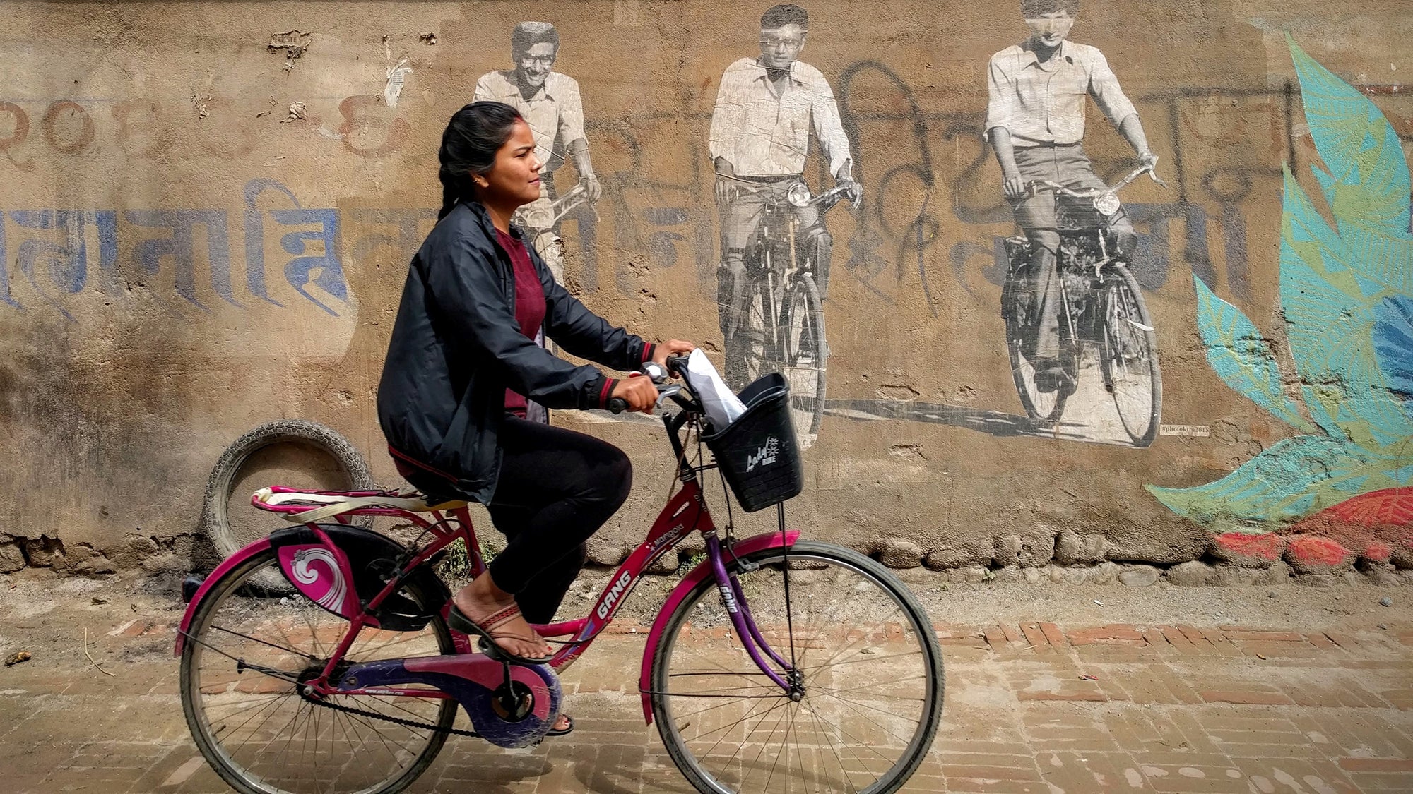 A cyclist in Patan, Nepal. Photo: Lucian Alexe/Unsplash