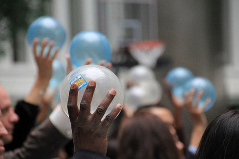 Audience members at the event were invited to take part by holding up different colored balls to help illustrate the proportion of people in the developing world without access to safety nets.