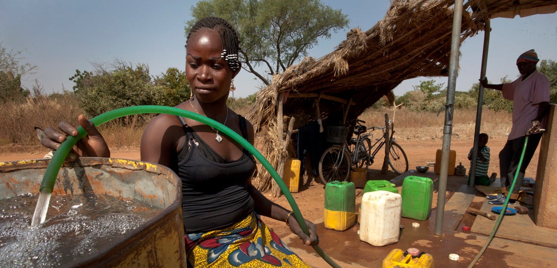 Kounda Asmaou collects clean water for her family on November 8, 2013 in Badnoogo village, Burkina Faso. Kounda Asmaou collects clean water for her family on November 8, 2013 in Badnoogo village, Burkina Faso.