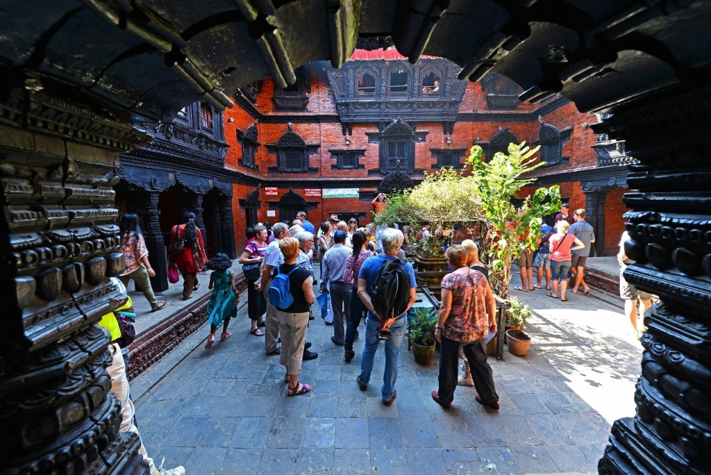 Tourists visiting the inner courtyard of the living Goddess Kumari in Kathmandu, Nepal, 2013. Photo: salajean / Shutterstock.com