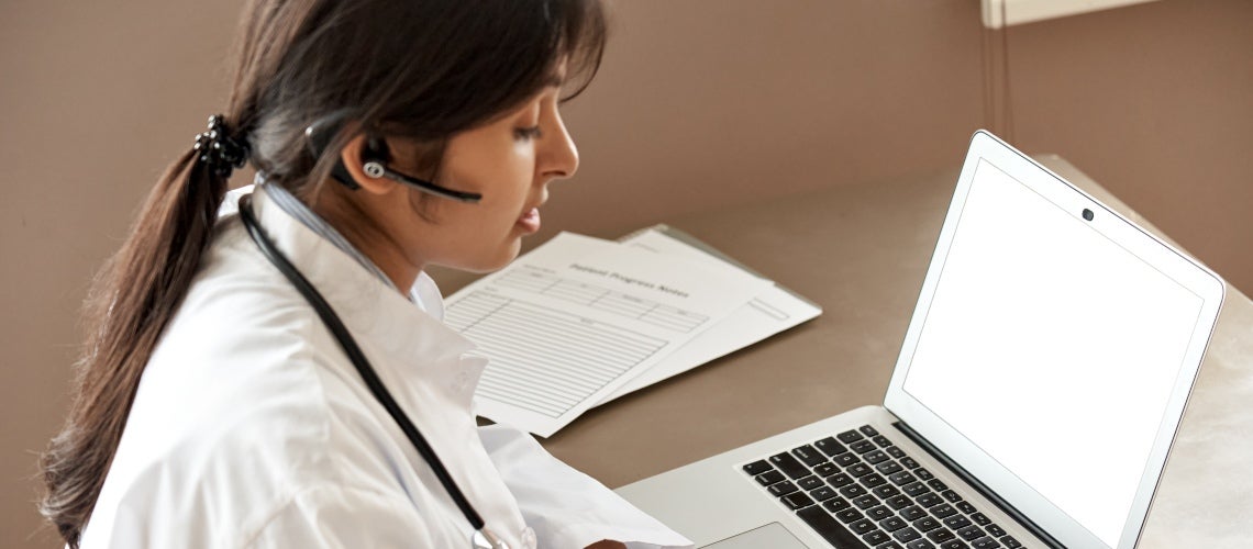 Doctor in front of laptop Doctor in front of laptop