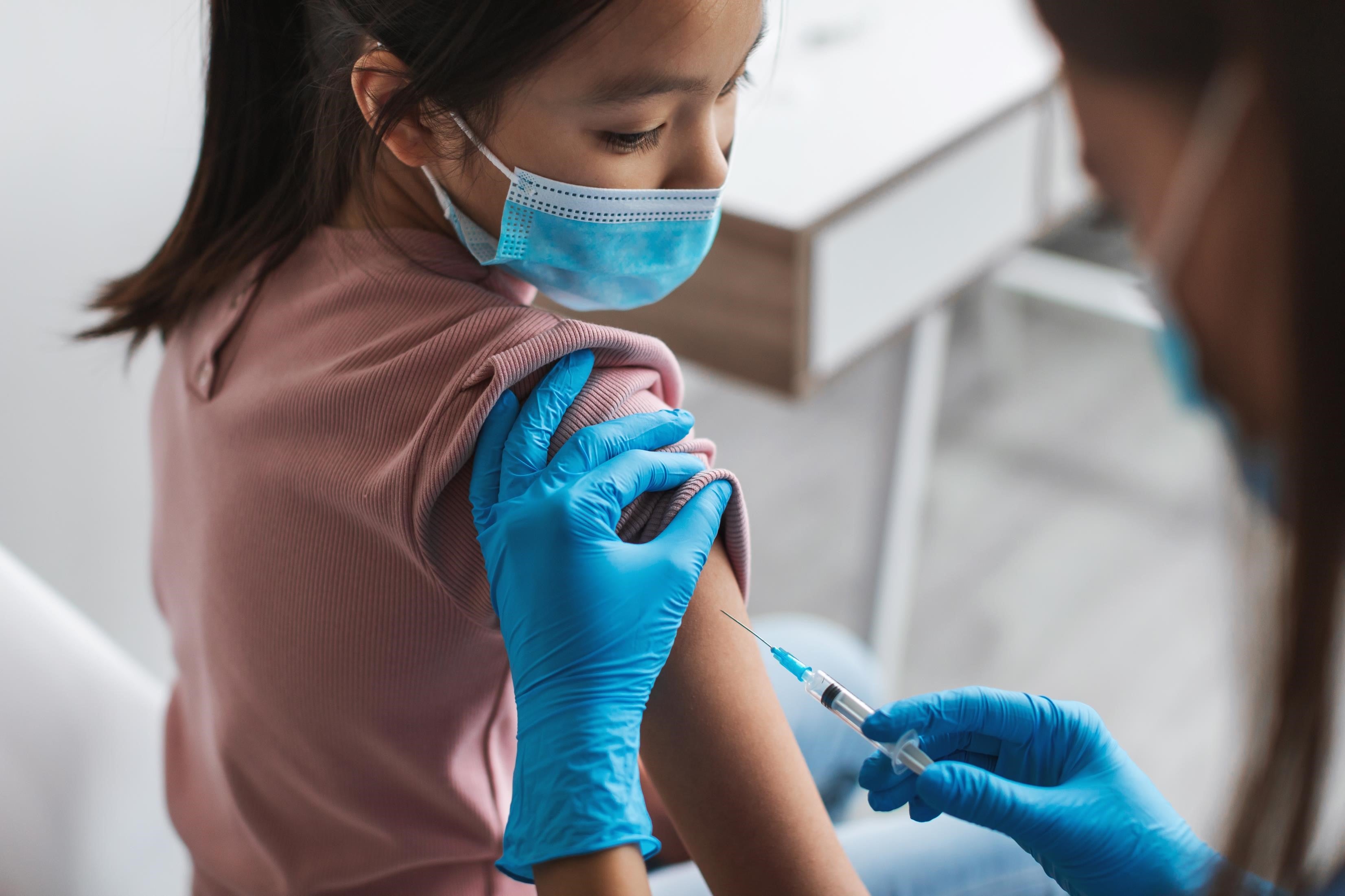 Korean girl getting Covid-19 vaccine.