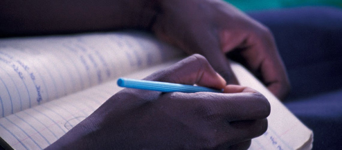 Student writing notes. Kenya. | © Curt Carnemark / World Bank