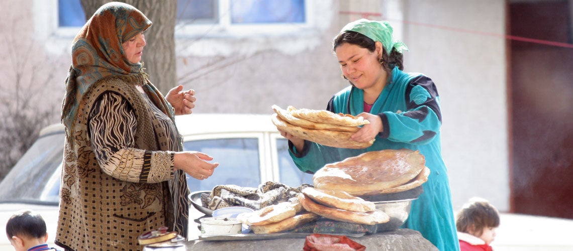Woman selling traditional bread in Tajikistan. Woman selling traditional bread in Tajikistan.