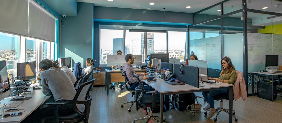 Syrian beneficiaries and Turkish citizens working in a software firm in Istanbul Syrian beneficiaries and Turkish citizens working in a software firm in Istanbul