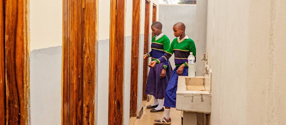 Girls at Filimule Primary School in Katavi, Tanzania, use the washroom, recently built with support from the Sustainable Rural Water Supply and Sanitation Program (SRWSSP). Girls at Filimule Primary School in Katavi, Tanzania, use the washroom, recently built with support from the Sustainable Rural Water Supply and Sanitation Program (SRWSSP).