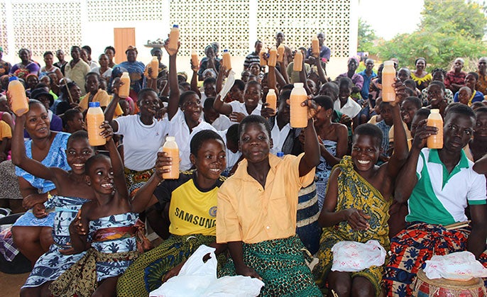 Children in Akatsi district in Ghana drinking a sweet-potato-based drink.