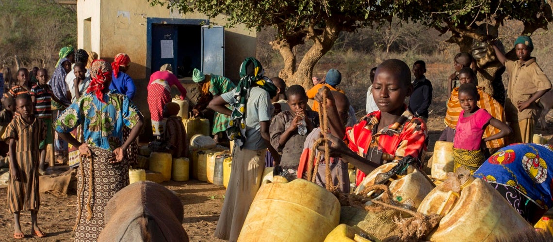 Villagers queuing for water at a pump in Kenya's arid Eastern Province