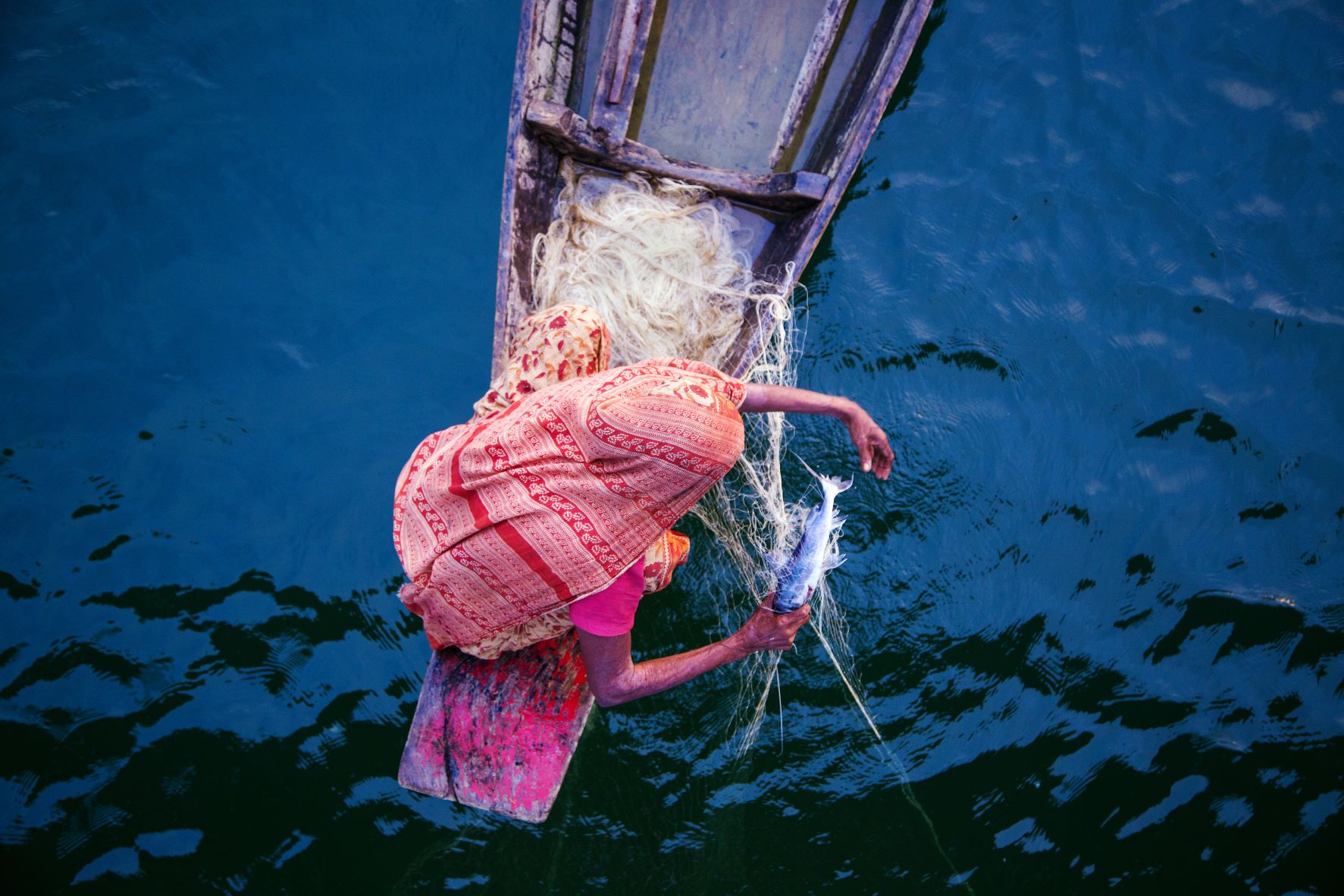 Woman fishing in Bangladesh