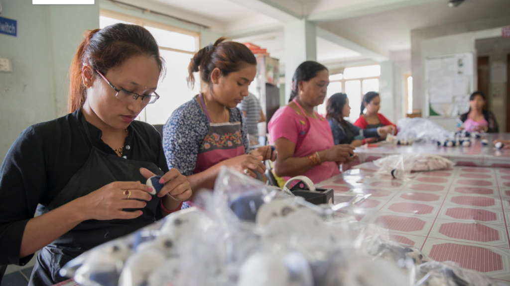 Women package handicrafts for export at Everest Fashion Fair Craft in Lalitpur, Nepal.