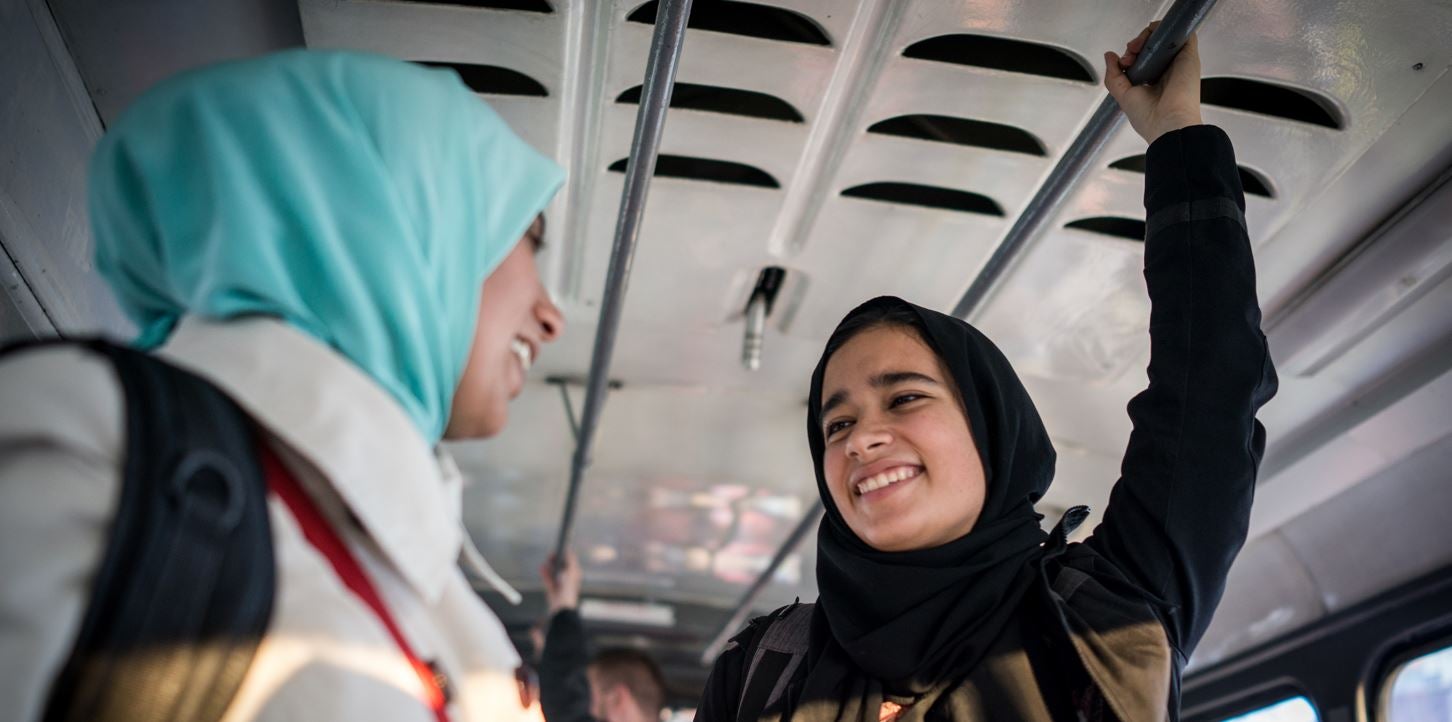 A mother and daughter riding public transport.